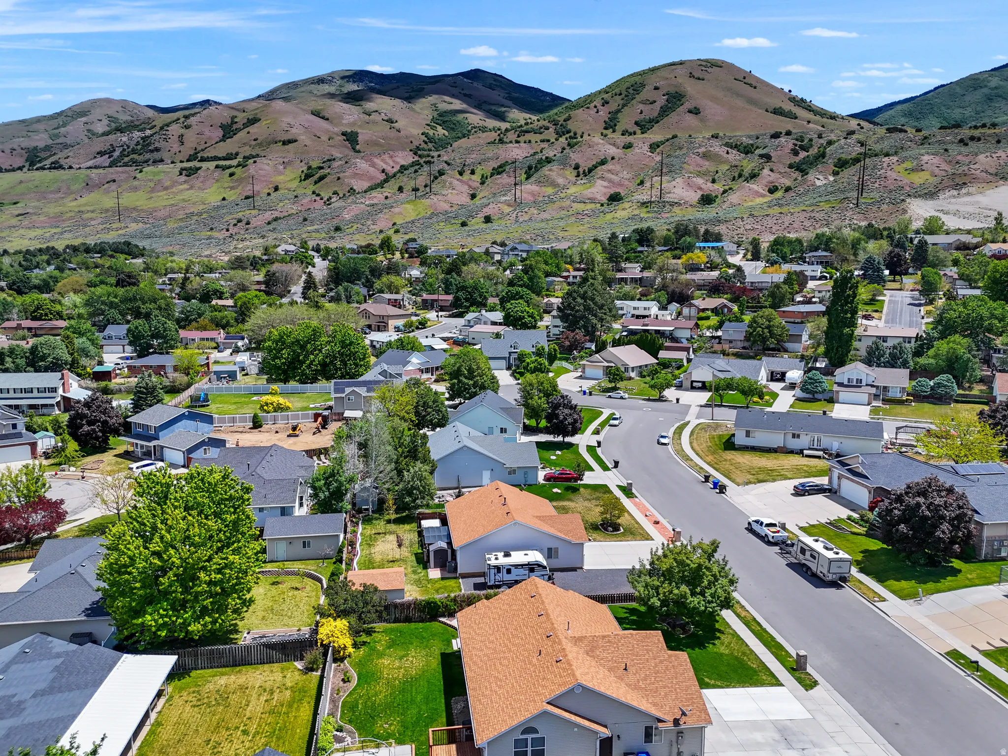 Aerial perspective showcasing a residential neighborhood with varied architectural styles and mature landscaping