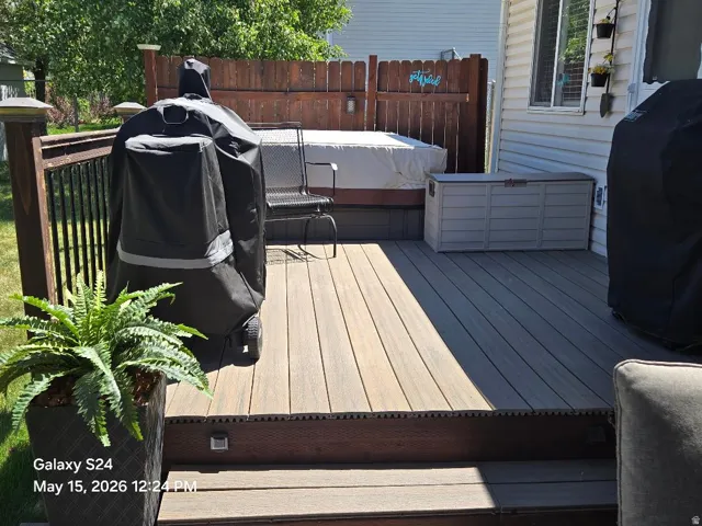 Multi-level composite decking with integrated step lighting and hot tub