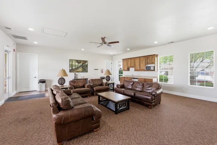 Club House Spacious common area featuring textured carpet flooring and recessed lighting