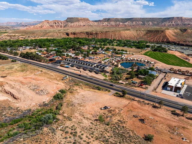 Aerial perspective featuring a scenic backdrop of geological formations