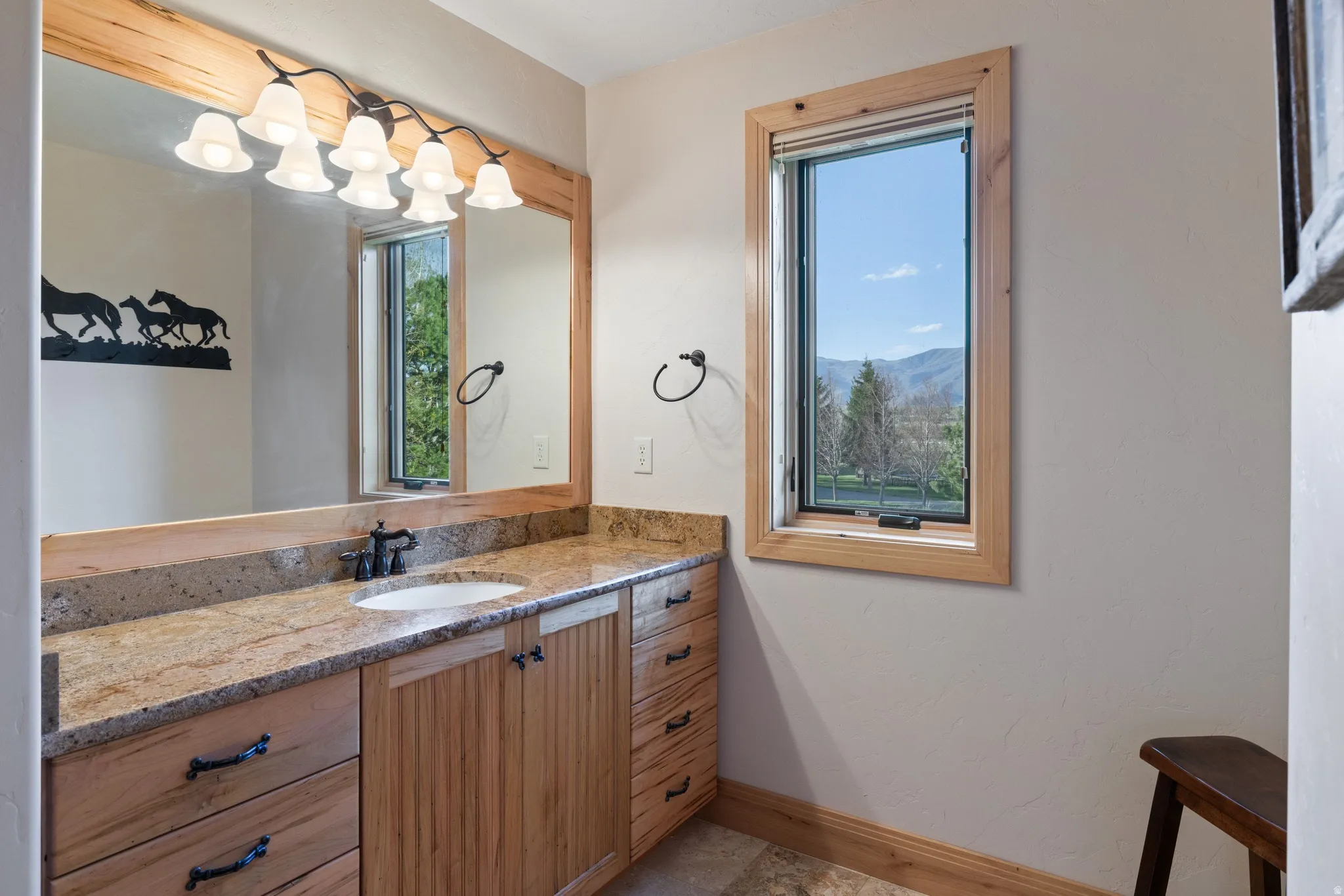 Bathroom featuring vanity and baseboards