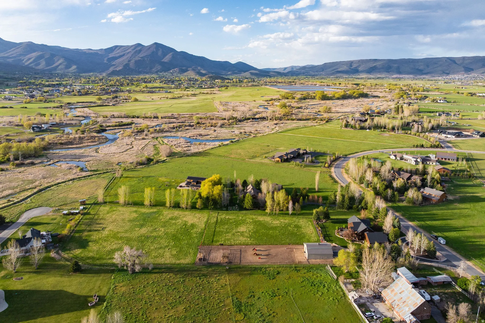 Overview of rural landscape featuring a water and mountain view
