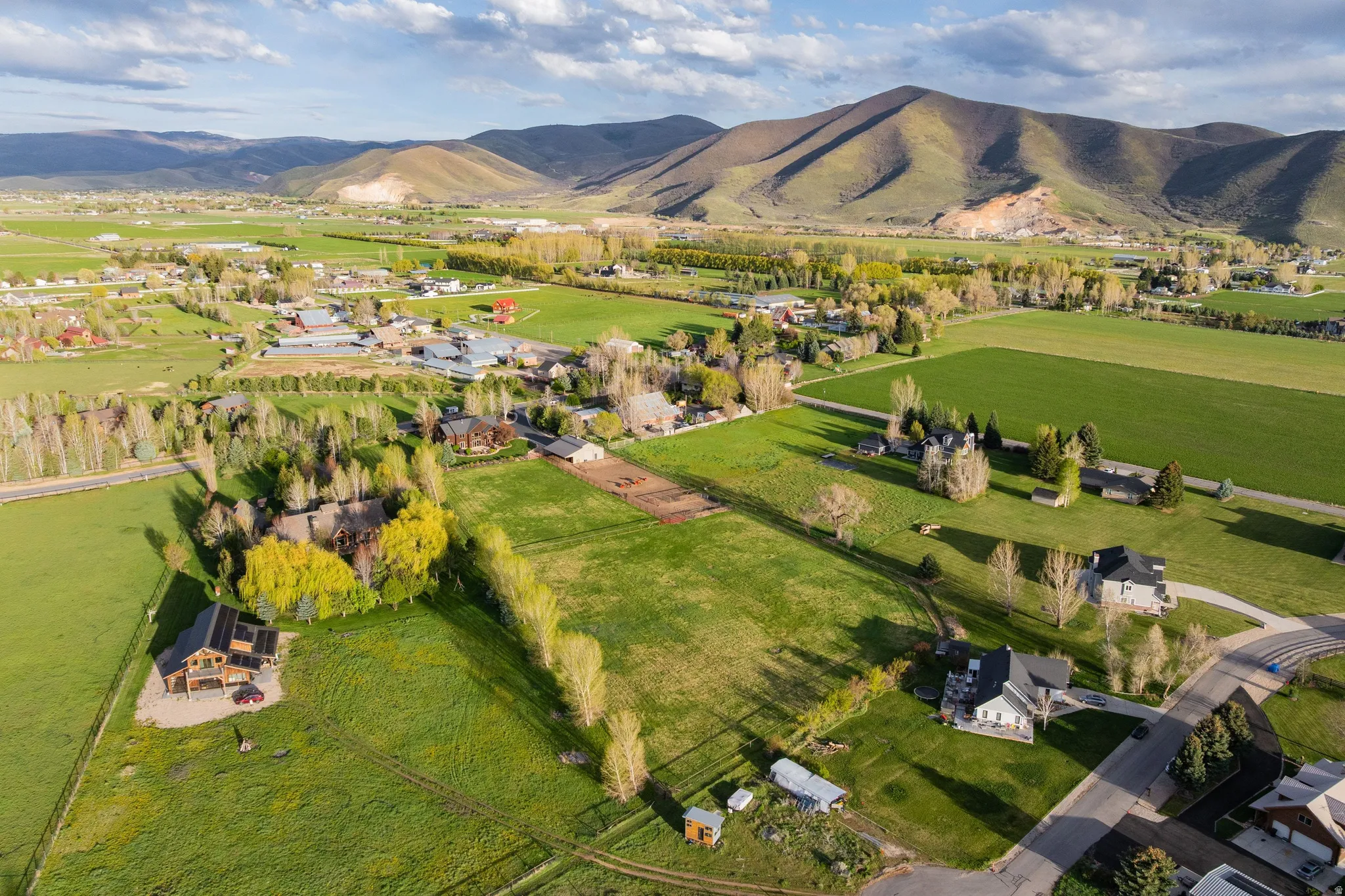 Overview of rural landscape with a mountain backdrop