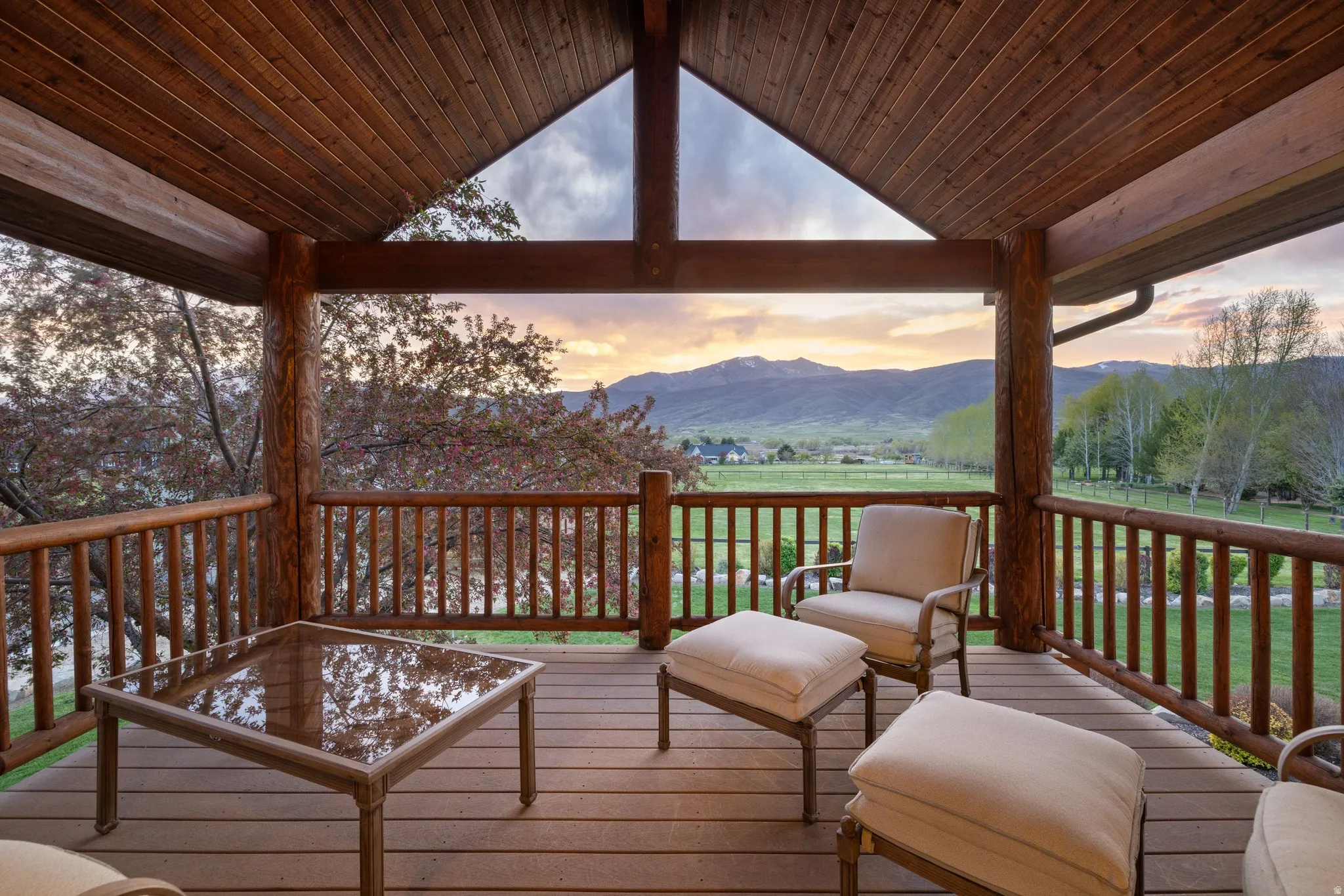 Deck at dusk featuring a mountain view
