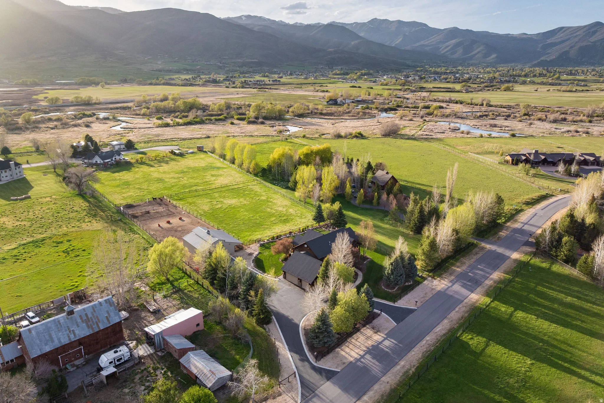 Overview of rural landscape featuring a mountain backdrop