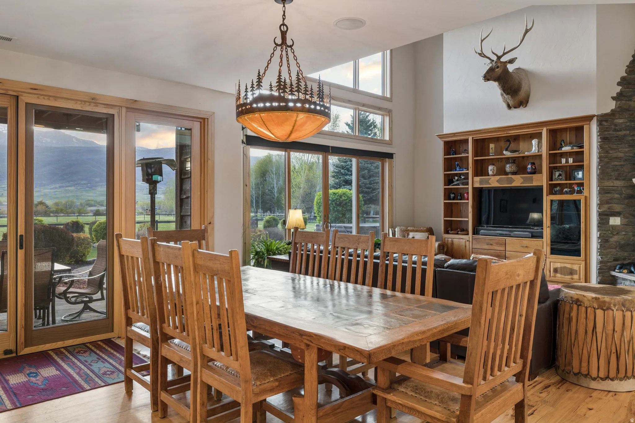 Dining room featuring a high ceiling and light wood finished floors