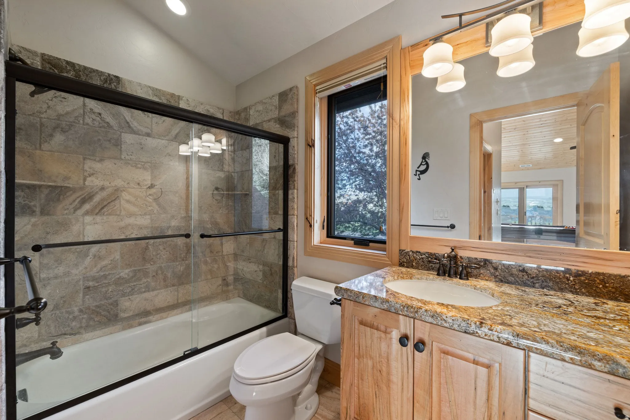 Full bath featuring vanity, combined bath / shower with glass door, and recessed lighting