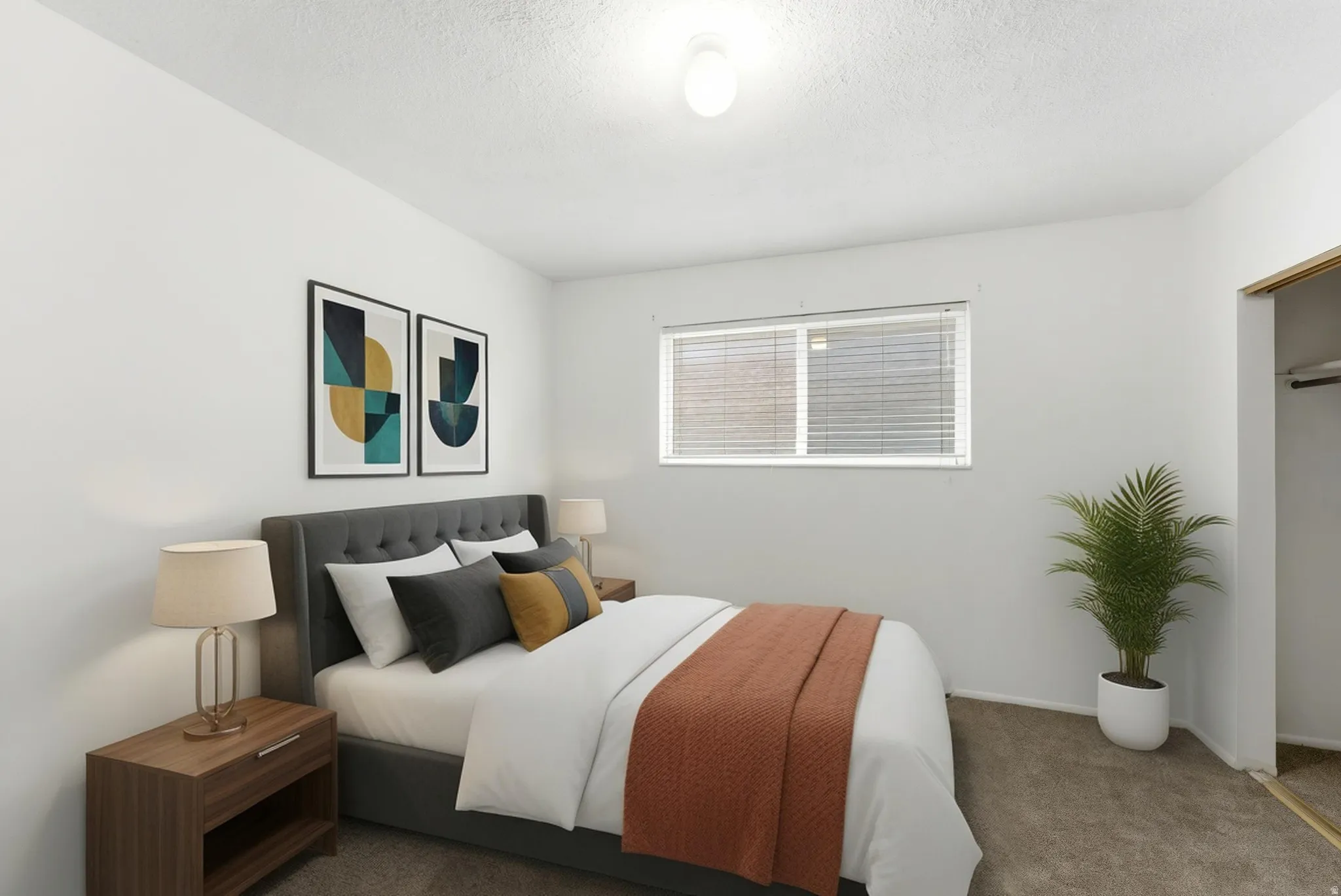 Bedroom featuring a window with horizontal blinds, overhead ceiling light, and carpet flooring