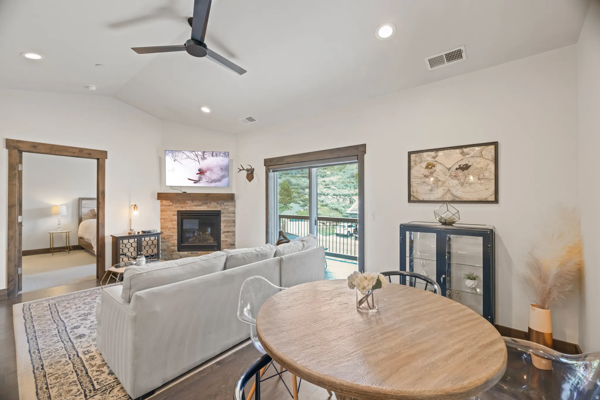 Open-concept living area with dark wood-finish flooring