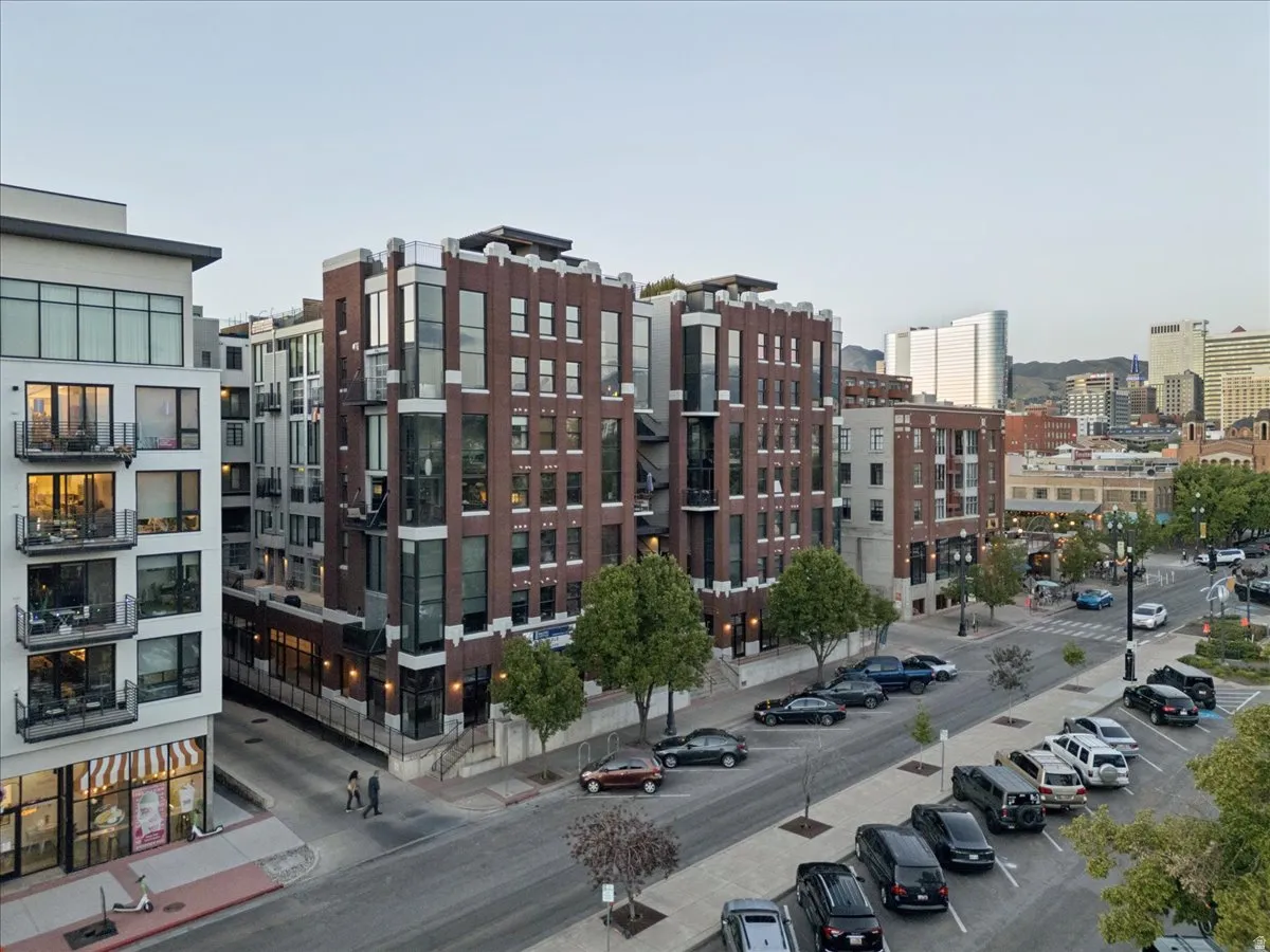 Contemporary urban architecture featuring a brick facade and extensive window walls