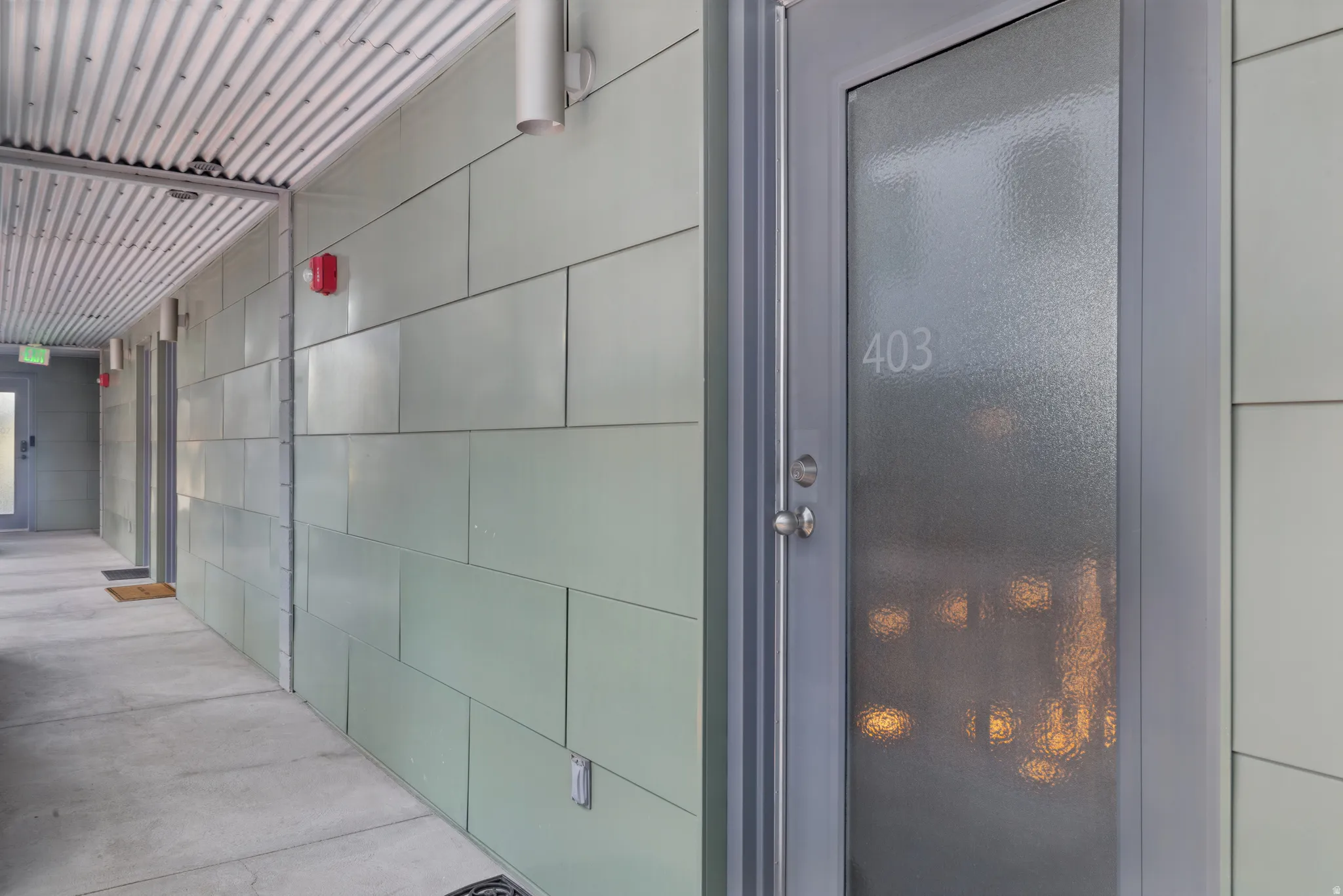 Entry door featuring frosted glass paneling and a modern handle set