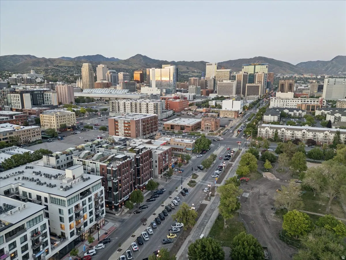 Panoramic urban landscape framed by distant mountains