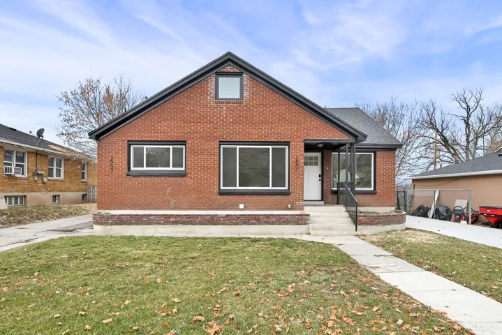Brick exterior featuring a gabled roofline