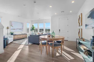 Open-concept interior featuring light wood-finish flooring and recessed lighting throughout