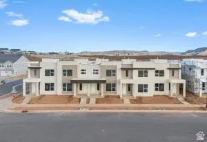 Modern townhome row featuring a neutral color palette