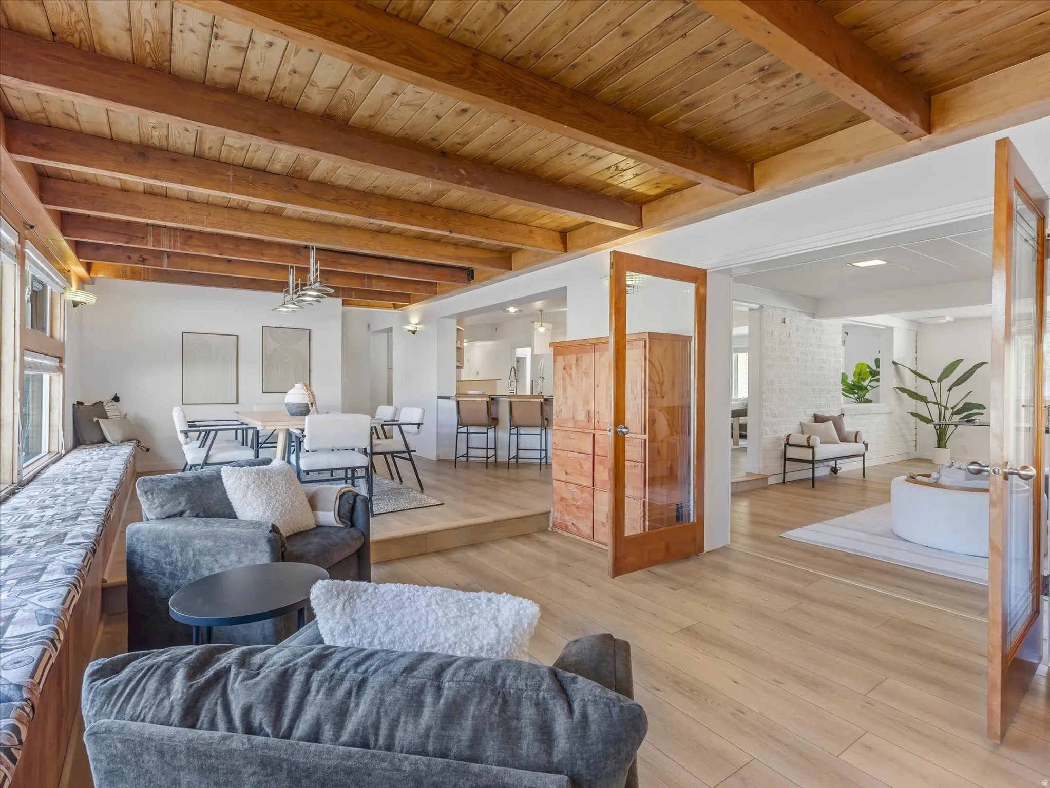 Den/Office Space with french doors, Exposed timber beam ceiling over light wood-finish flooring