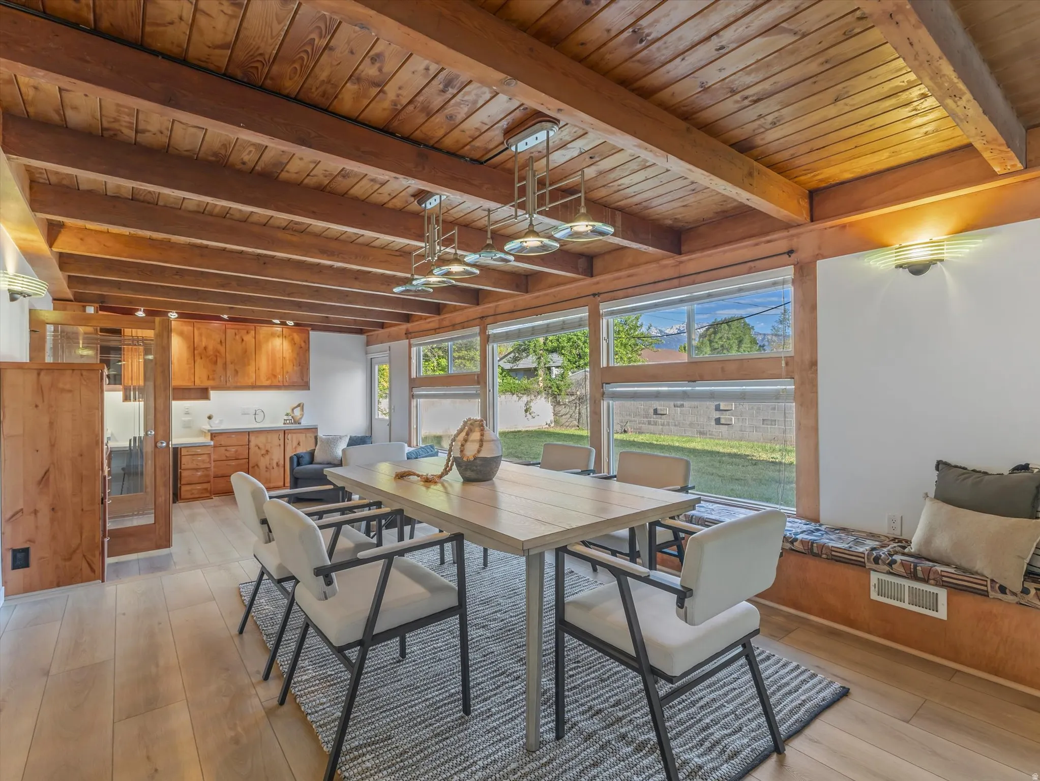 Exposed wood beam ceiling with recessed lighting