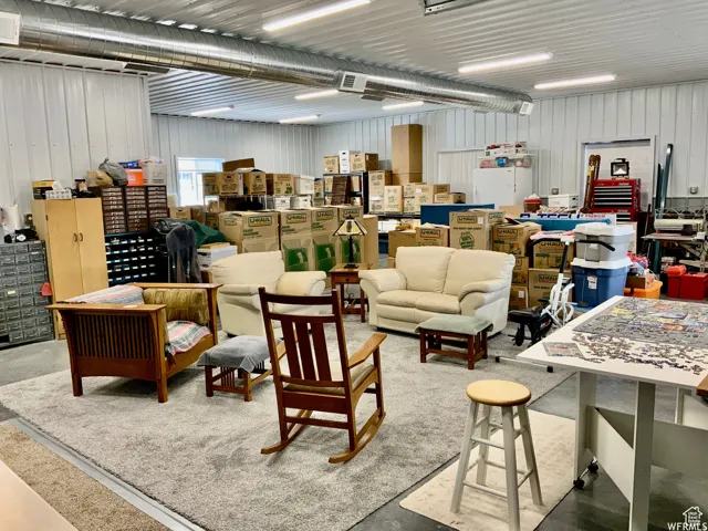 Spacious interior with industrial-style corrugated metal walls and ceiling