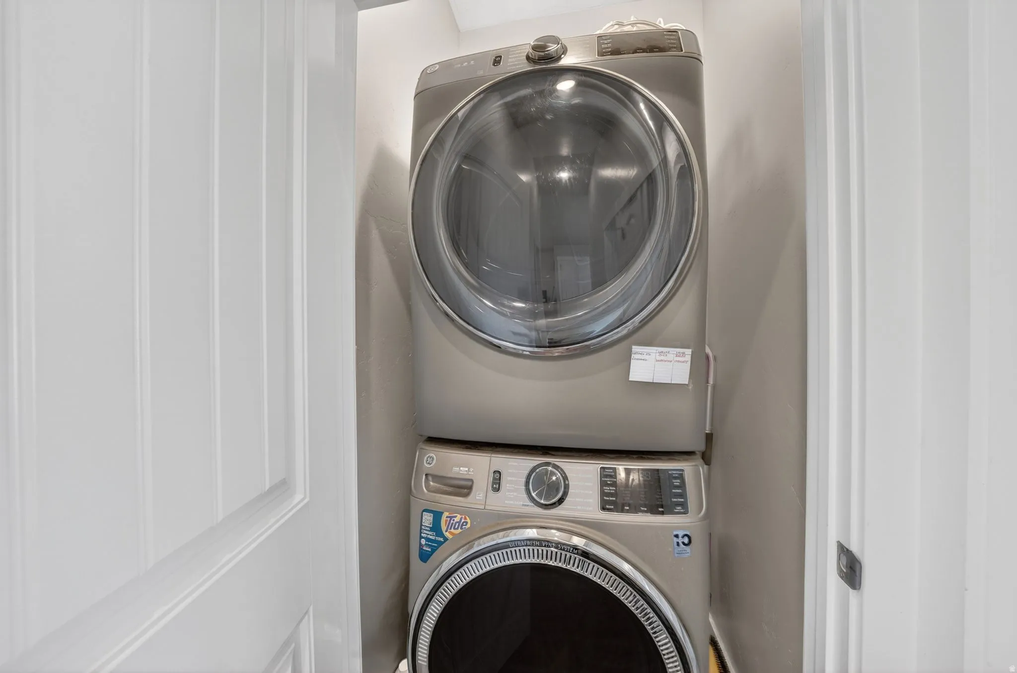 Stackable front-loading washer and dryer in a dedicated laundry closet