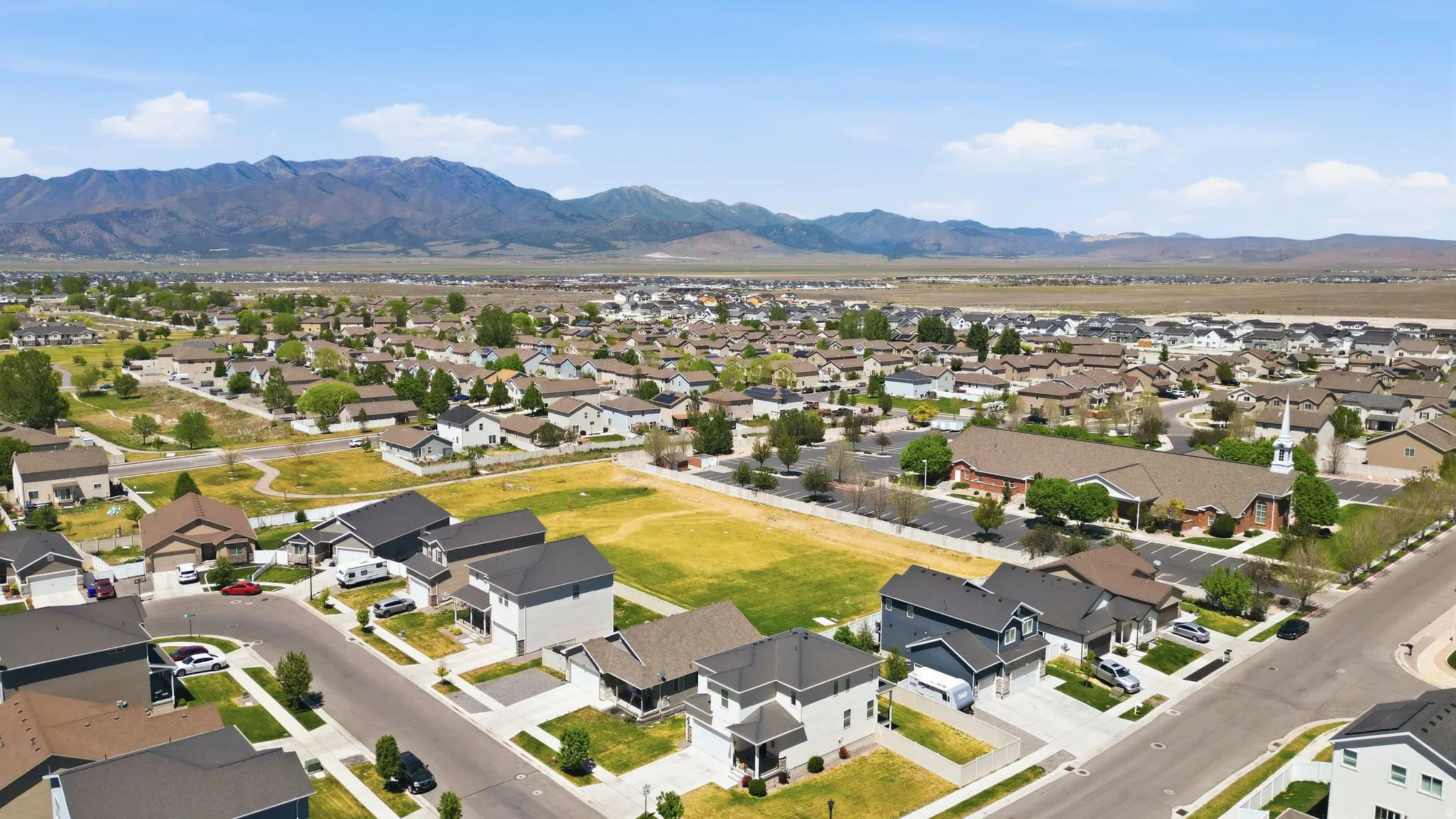 Aerial perspective showcasing a residential neighborhood with varied home styles and mature landscaping