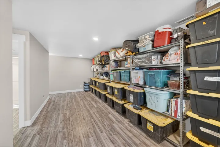 Versatile bonus room featuring wood-finish flooring, recessed lighting, and neutral wall tones