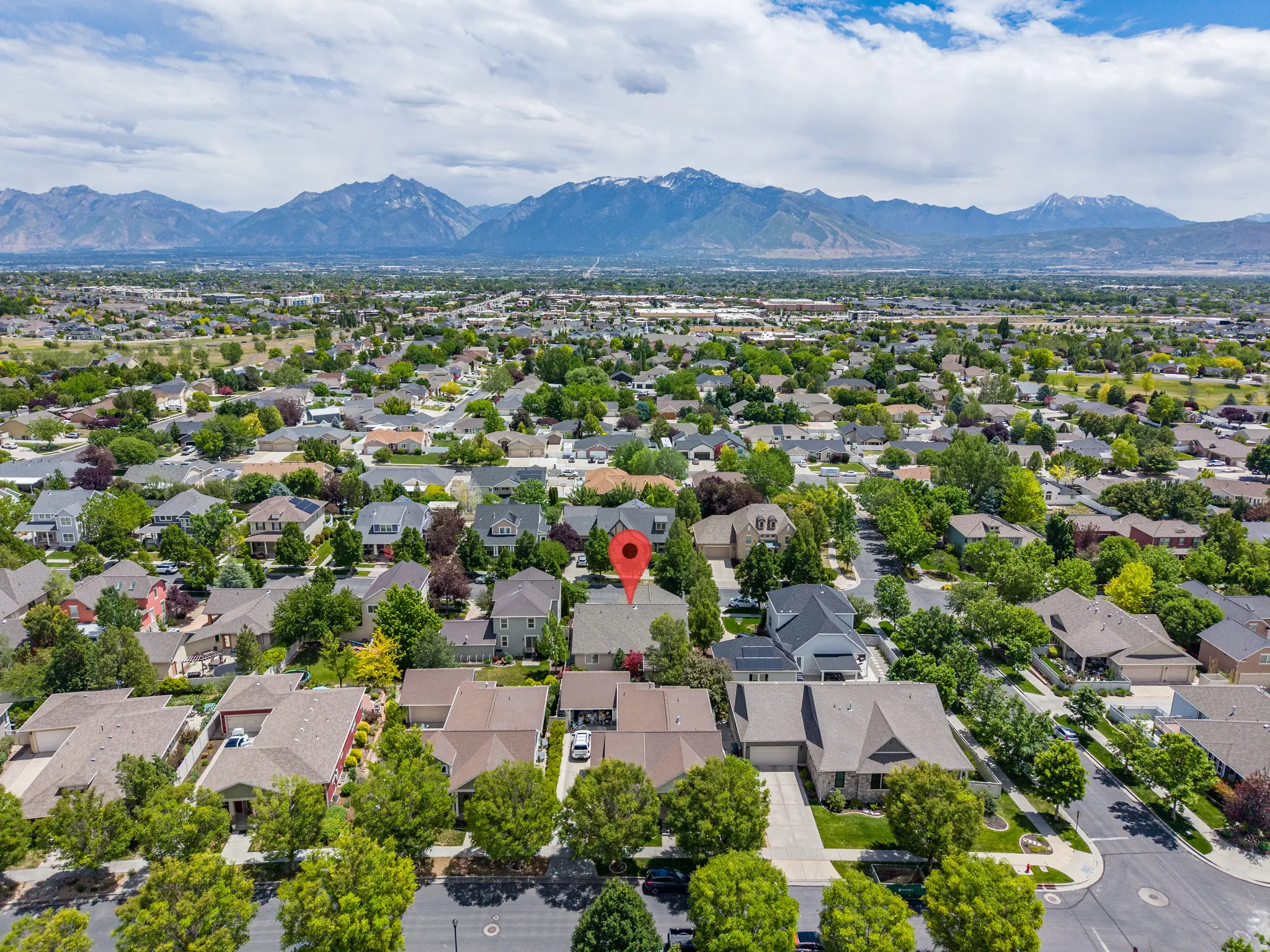 Aerial perspective showcasing the residential area with a prominent mountain backdrop