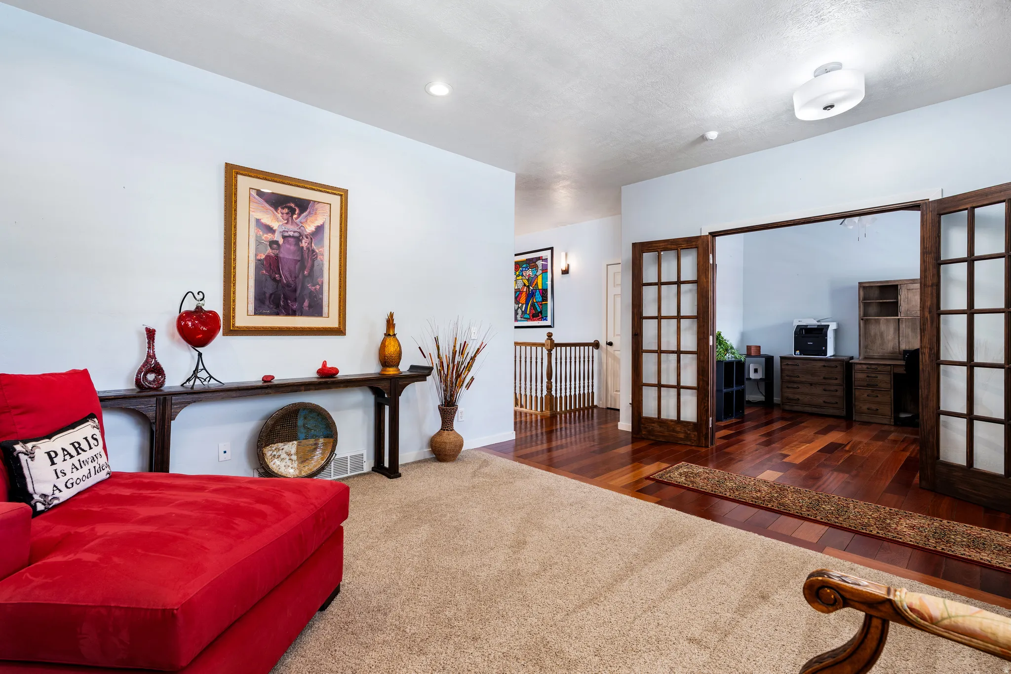 Entryway with plush carpet and a console table