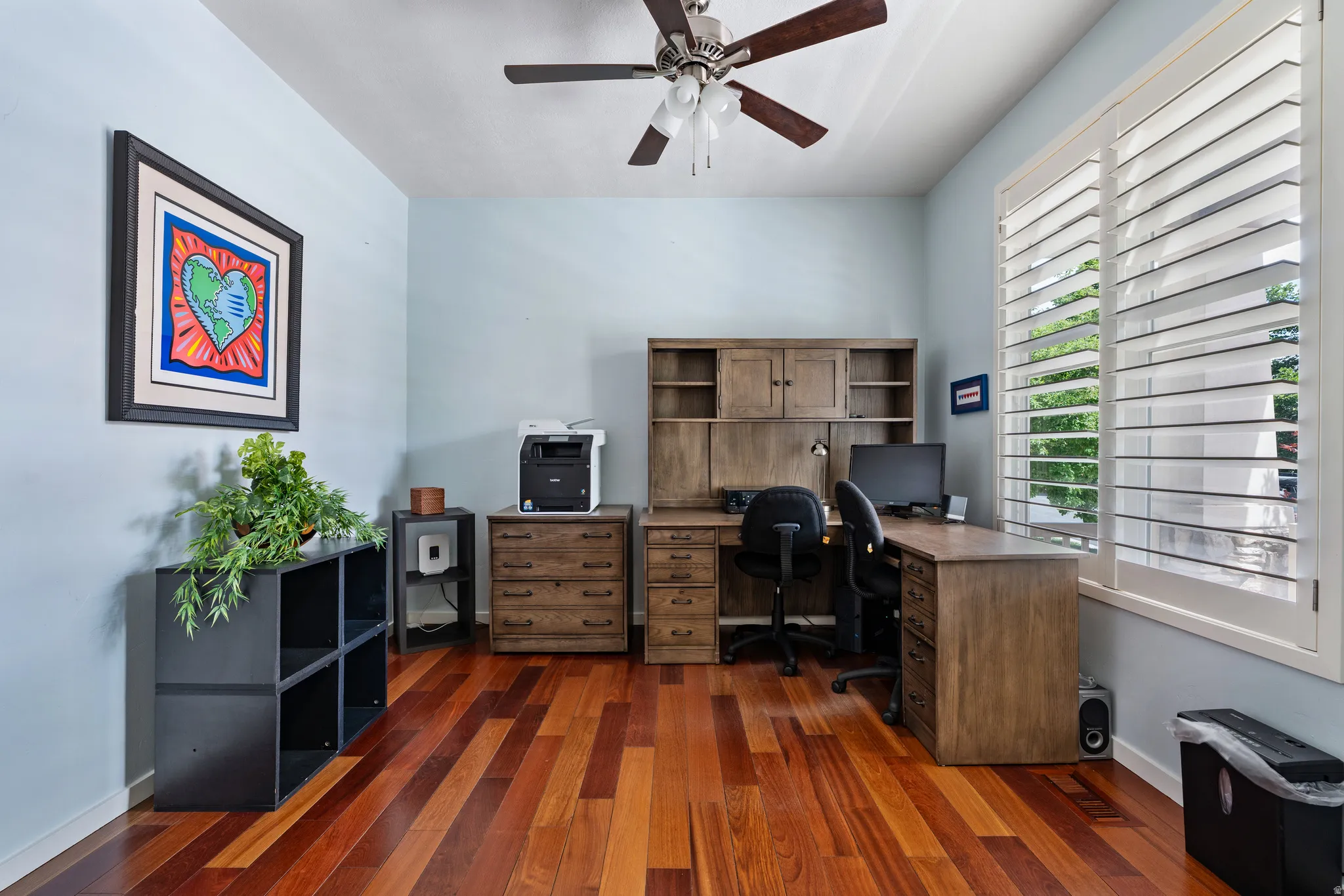 Warm wood-finish flooring complements light-toned walls