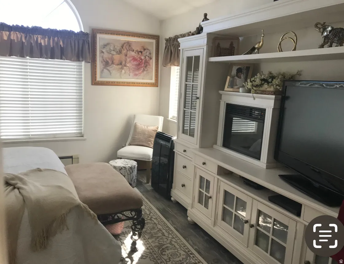 Built-in media console with integrated electric fireplace and display shelving