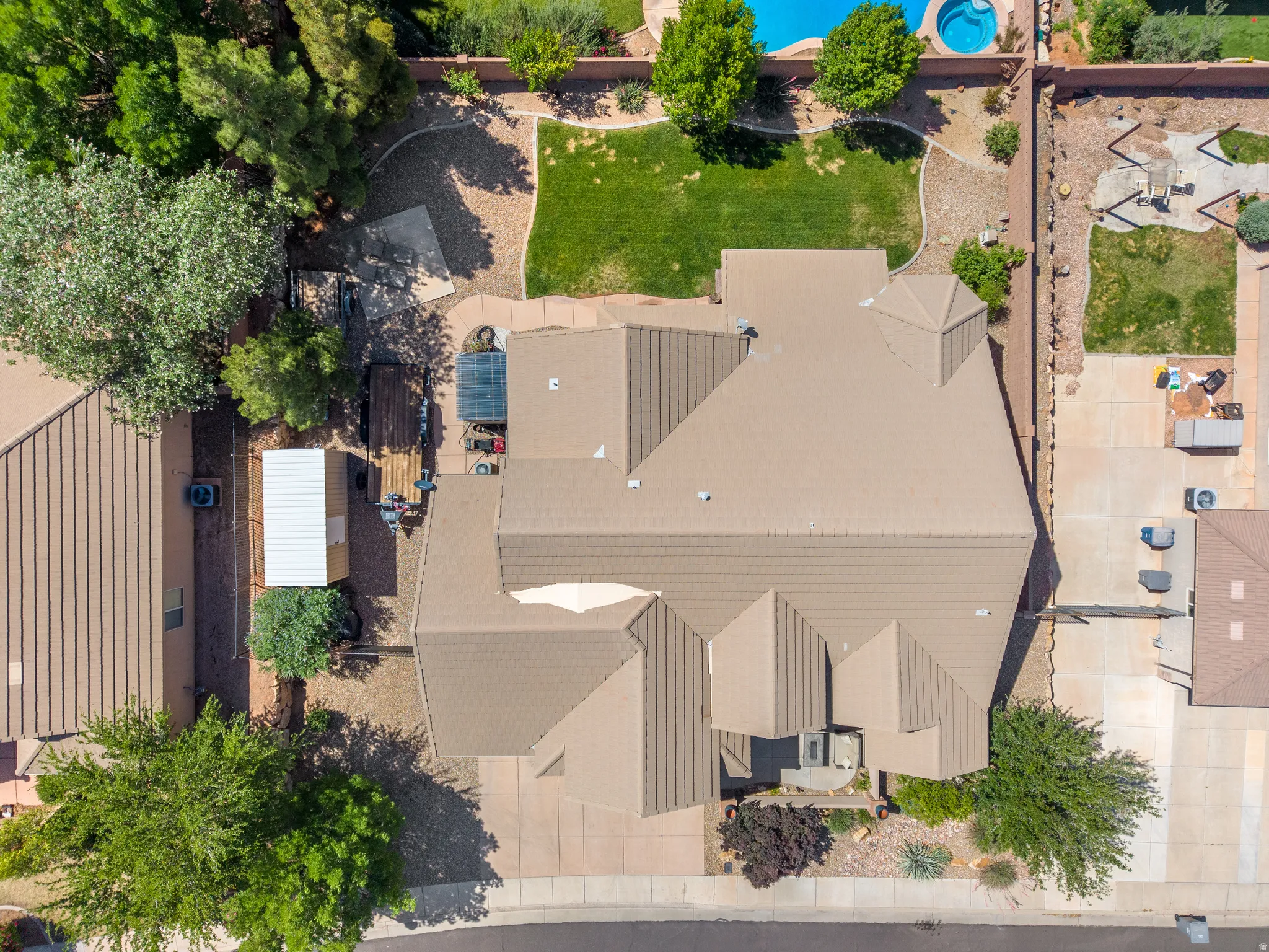 Aerial perspective highlighting the property with a private pool and integrated spa