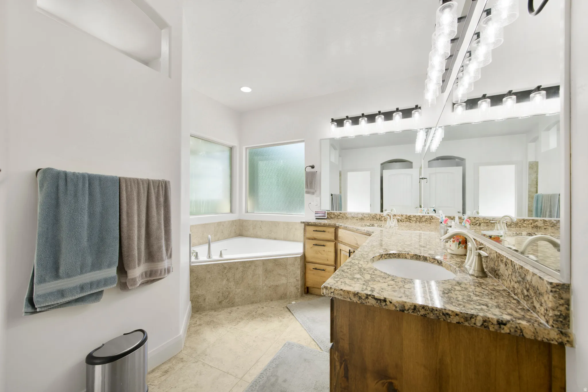 Dual vanity with granite countertops and undermount sinks