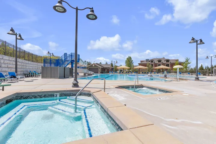 Two integrated hot tubs with mosaic tile accents