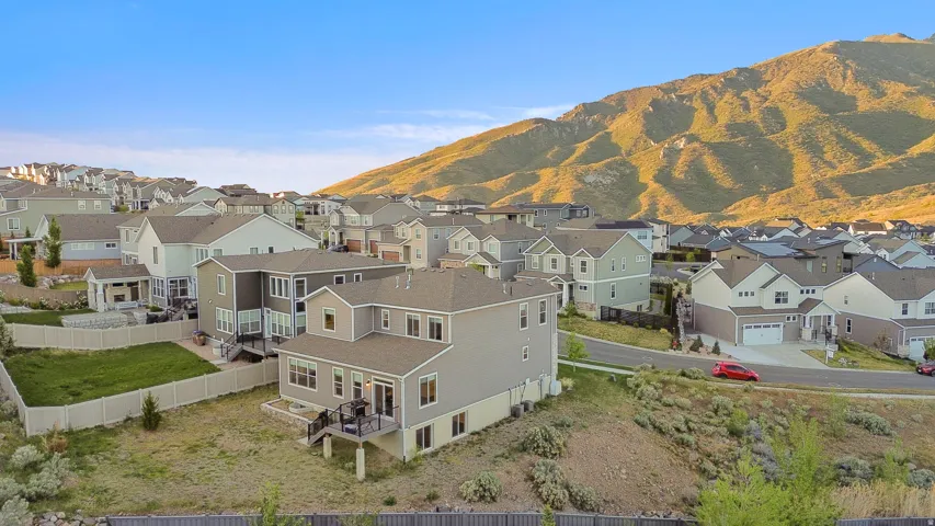 Modern residential community set against a mountainous backdrop