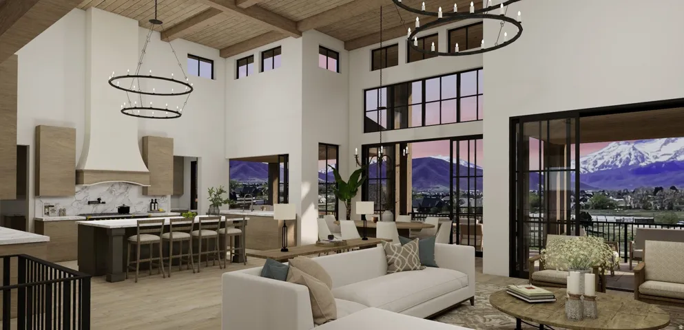 Expansive open-concept living area featuring a vaulted wood-beam ceiling, two-story windows, a large kitchen island with seating, and a covered outdoor balcony