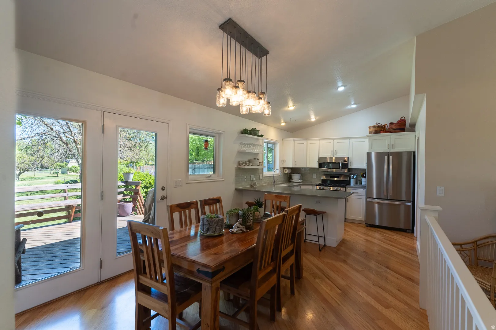 Start making memories in this delightful kitchen !  Updated, with  beautiful wood cabinets, fun light fixtures, lots of light,  and walk out to the spacious deck !