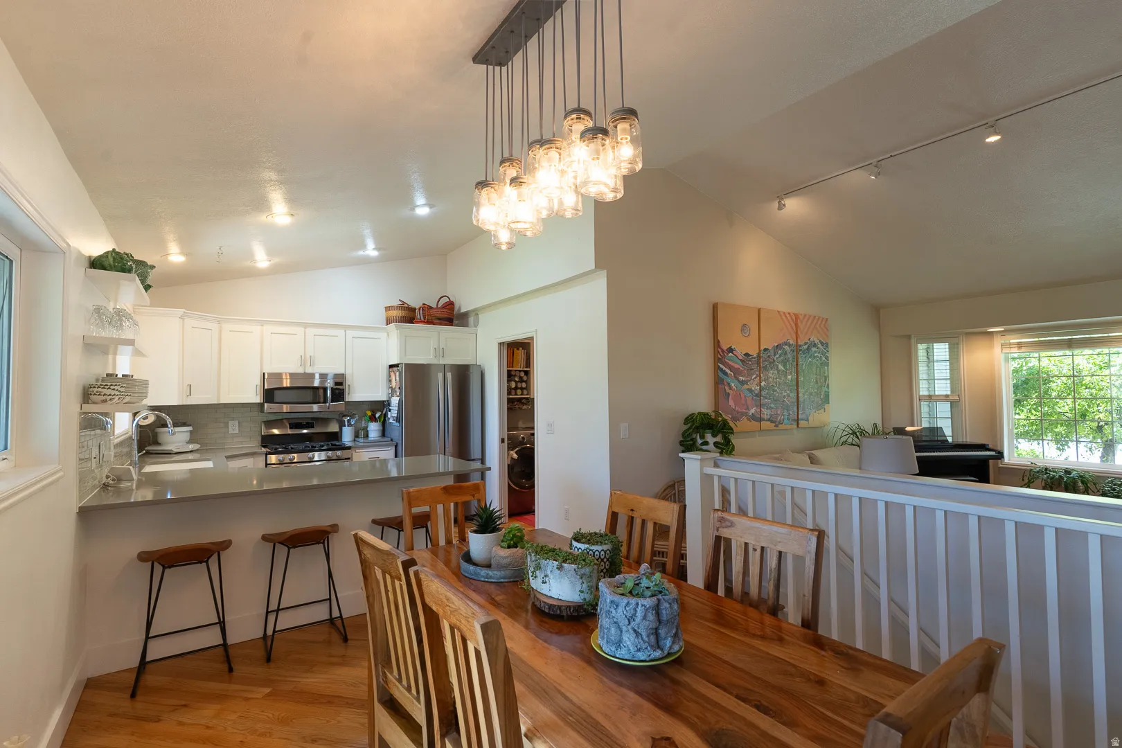 Kitchen and living room open concept is perfect for entertaining! Views of greenery from every window !  Come feel, relax and cook up some dinner!