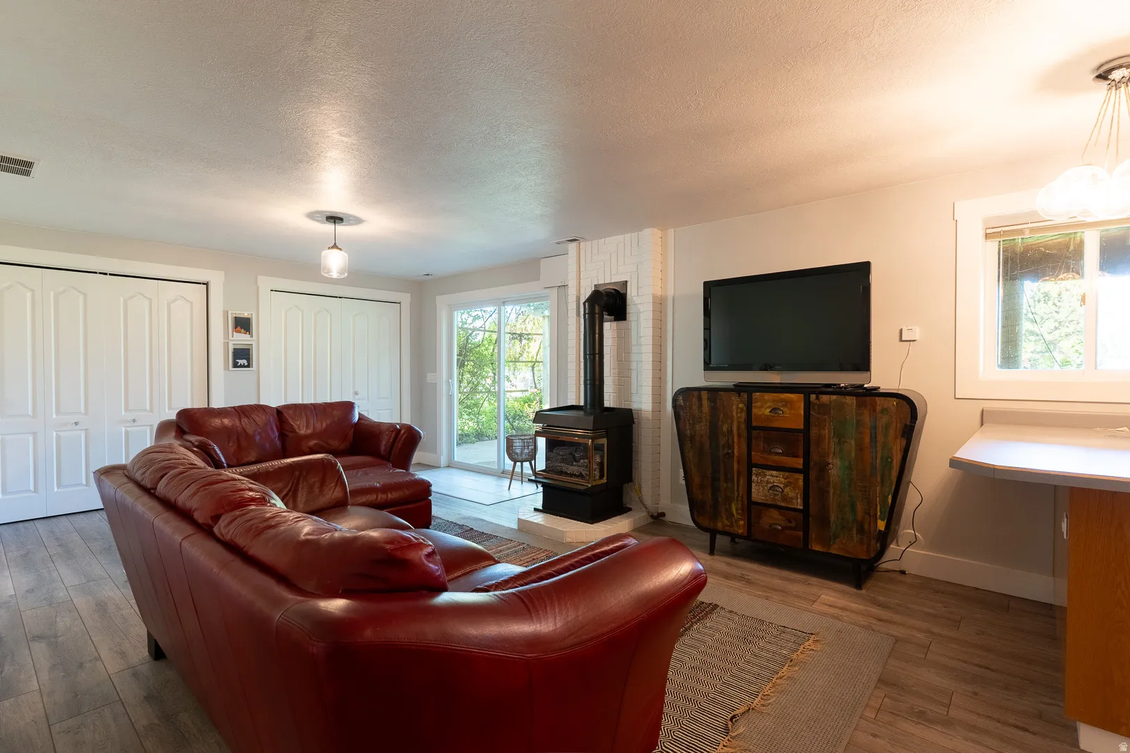 Family room with a walk out, double closets for storage.  You'll keep warm with the gas fireplace, and enjoy the wet bar if needed.