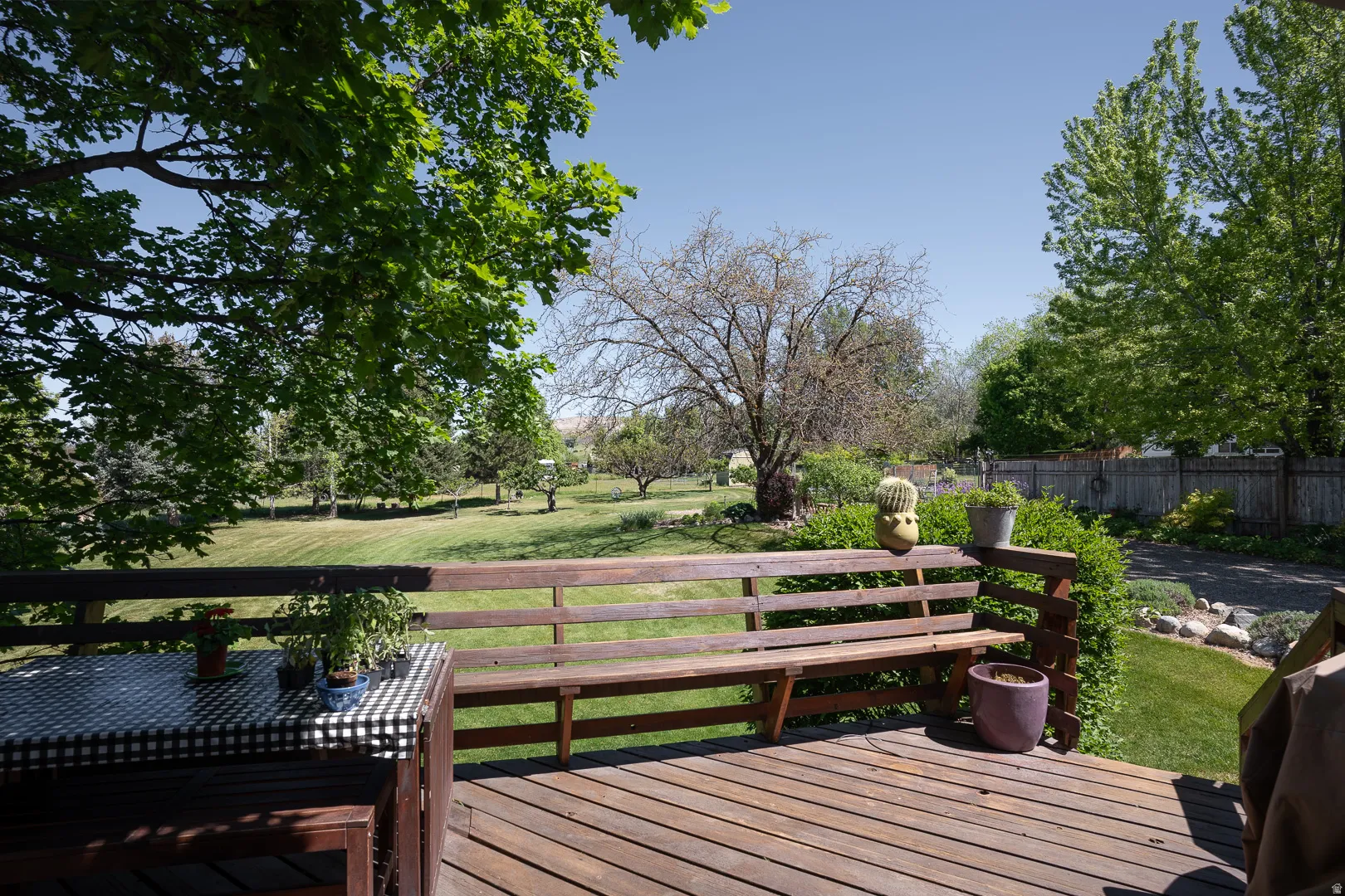 Large and sturdy  back deck off the dining area, walk to the back yard, or sit and enjoy the sun, and shade.