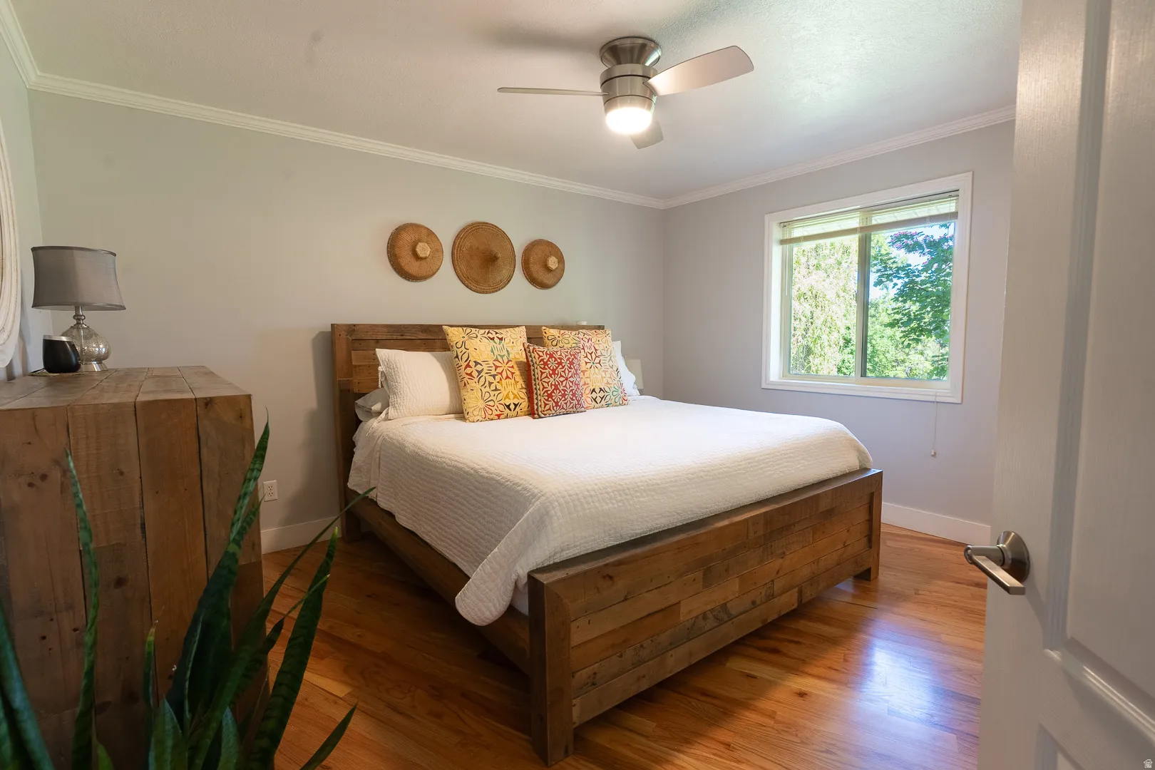 Classic master bedroom with walk-in closet, and shower bathroom.  Custom light and fan fixture, beautiful wood floors!