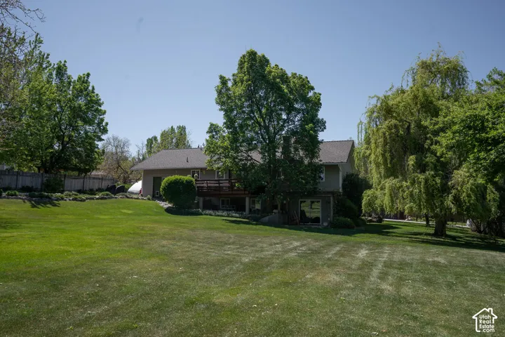 View of the back yard and back of home on the .78 acre lot.