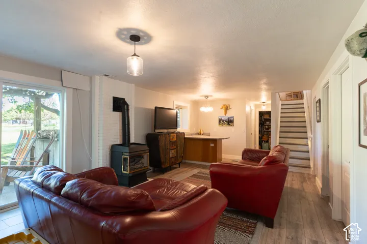 Walk out to the pergola patio with your drink from the wet bar, or stay cozy next to the gas fireplace watching the big screen. You'll love the updated defining light fixtures throughout the home !