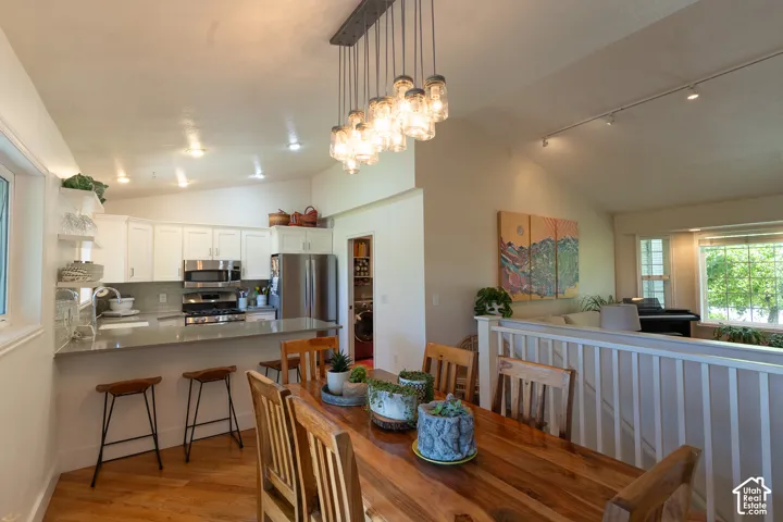Kitchen and living room open concept is perfect for entertaining! Views of greenery from every window !  Come feel, relax and cook up some dinner!