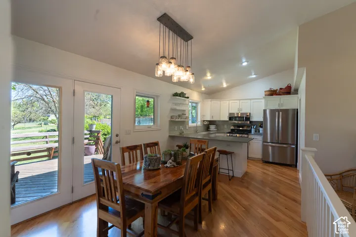 Start making memories in this delightful kitchen !  Updated, with  beautiful wood cabinets, fun light fixtures, lots of light,  and walk out to the spacious deck !