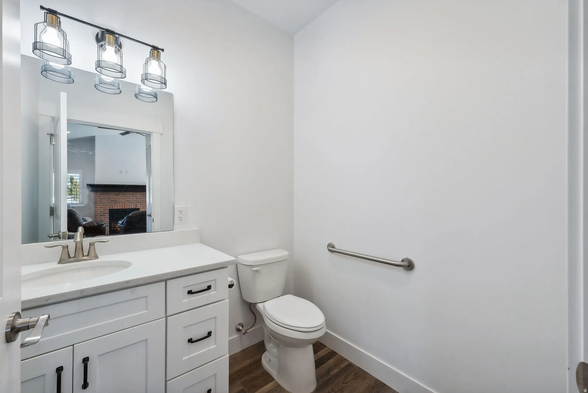 Custom built ADU/Bathroom featuring a single vanity with white cabinetry, a rectangular undermount sink, and a light-colored countertop