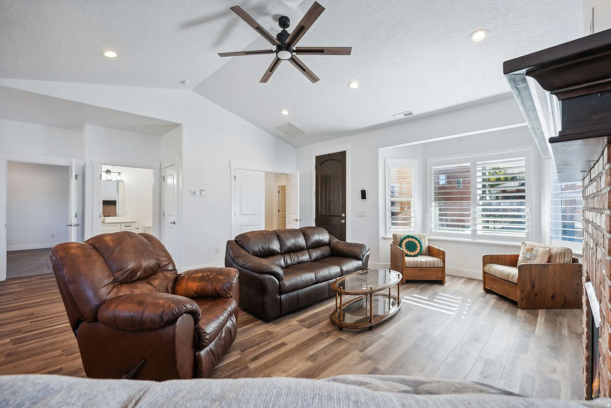 Custom built ADU/Living area featuring wood-finish flooring, vaulted ceilings, and recessed lighting