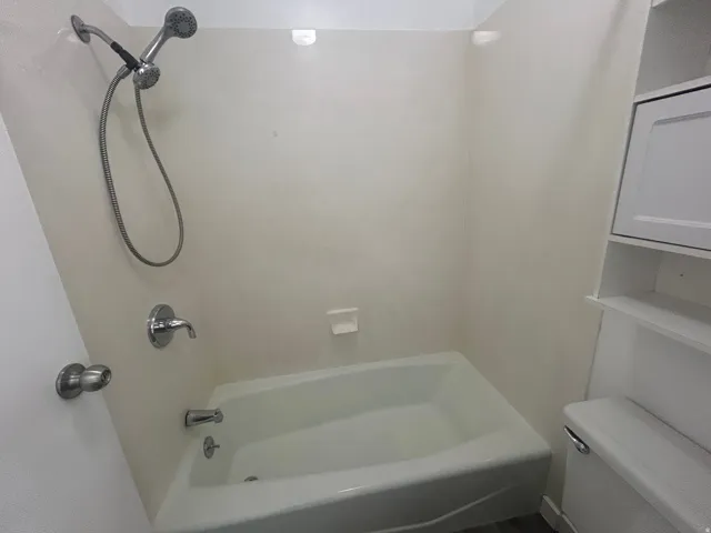 Full bath, tub/shower and toilet with vanity
