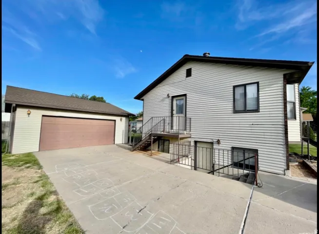 Detached garage with a brown garage door