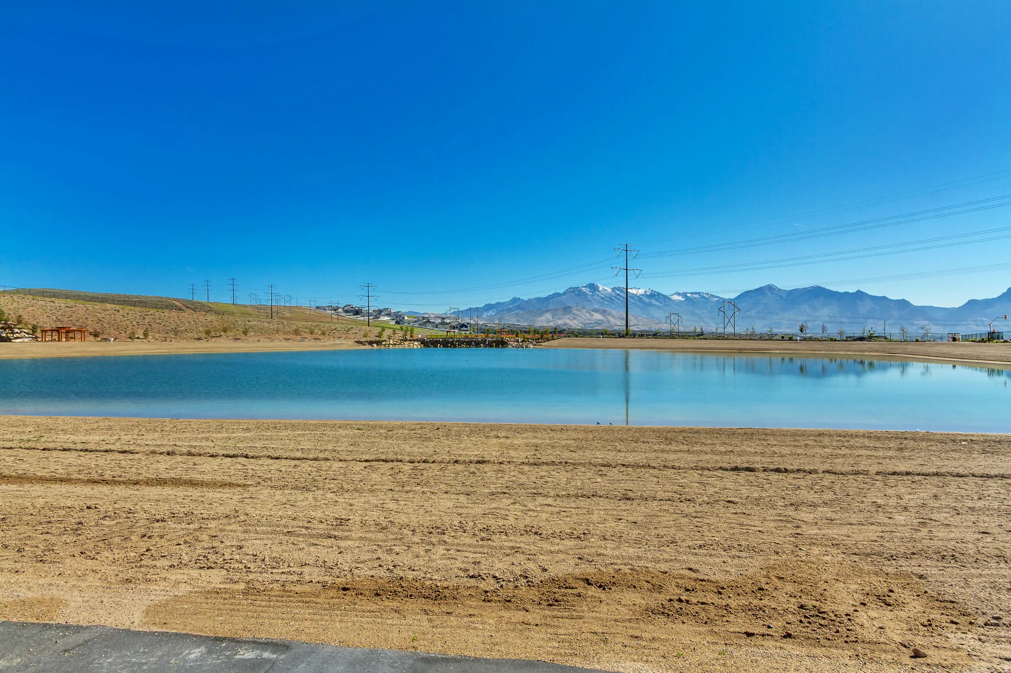 Expansive body of water with surrounding arid landscape