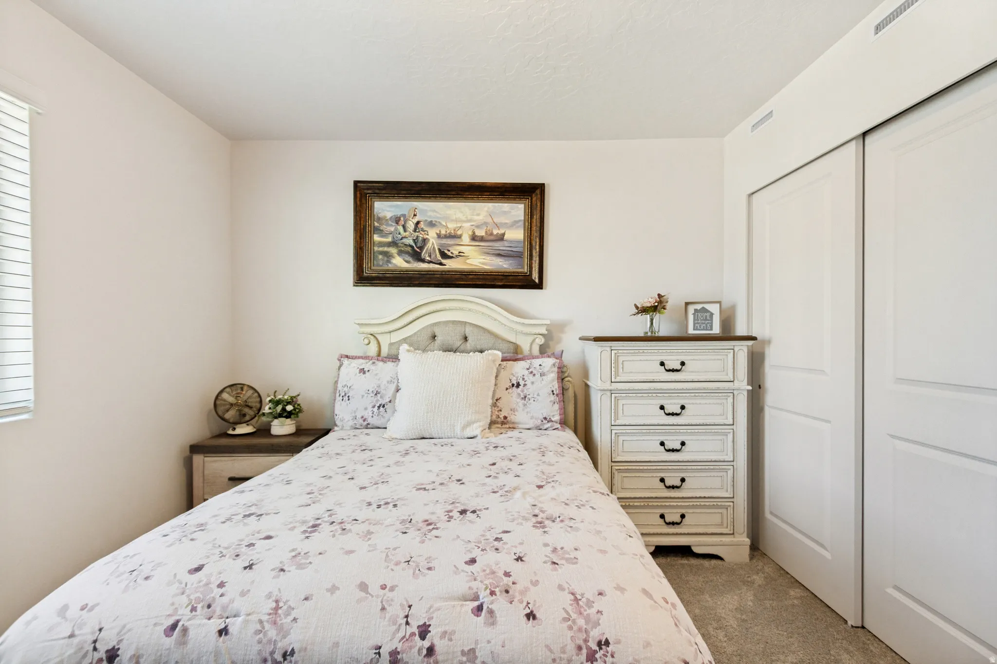 Neutral-toned walls and light-colored carpeting
