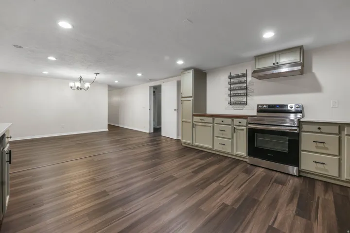 Kitchen / Break Room featuring ample cabinet and countertop space, sink, dishwasher and stove. Located in the bsmt of the North Bldg